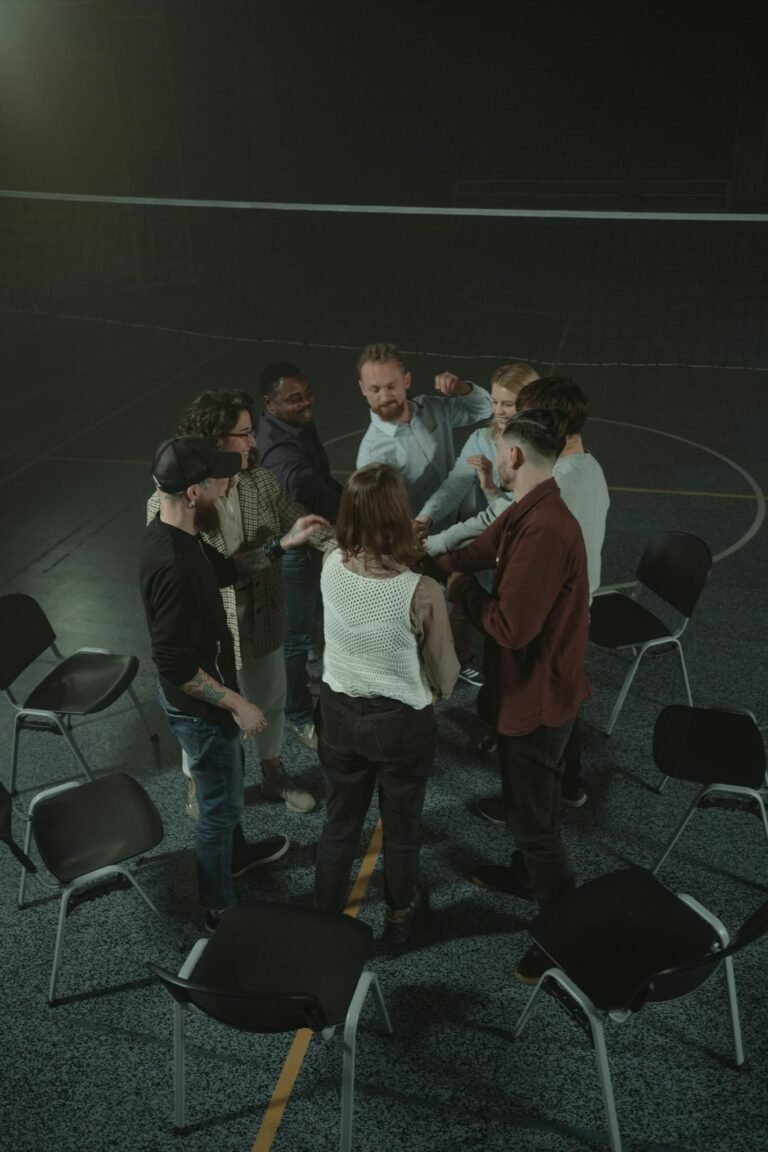 People Standing on Stage in Front of People